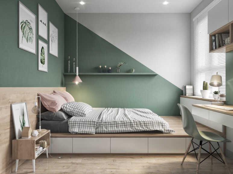 A bedroom with a collection of mint green furniture a combination of mint green and gray walls and a gray bedding set