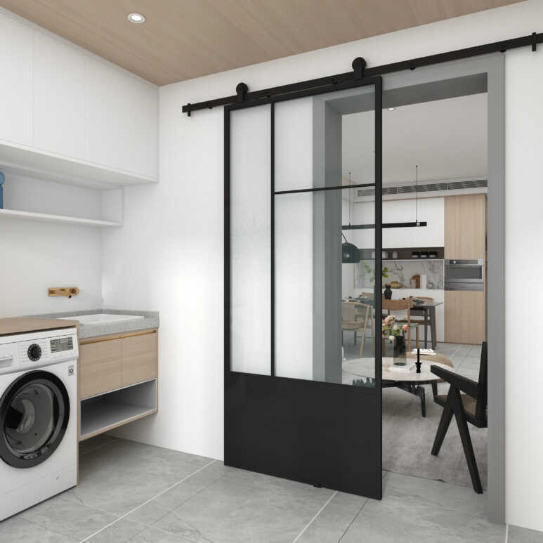 A black metal barn door with a glass panel makes the laundry room look larger and highlights a contemporary industrial vibe
