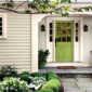 A bungalow house with window panels front door painted in cucumber green