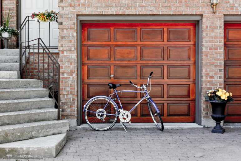 A combination of the brick walls and Tuscany garage door in an Italian-style house