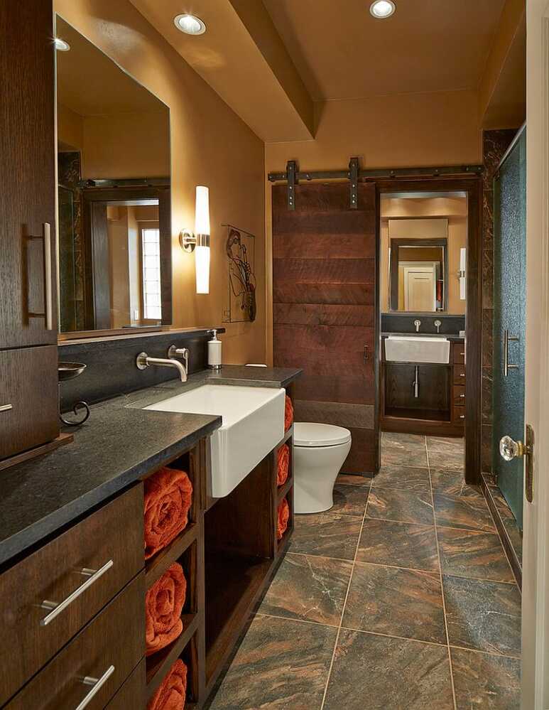 A fascinating contemporary bathroom with a black walnut barn door