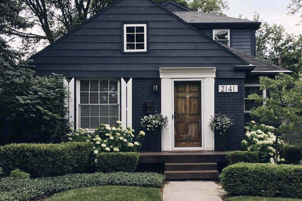 A minimal-traditional house style in all dark grey with little white trim