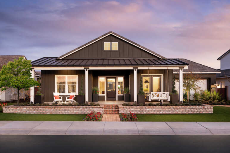 All dark grey with white trim to a simple bungalow house