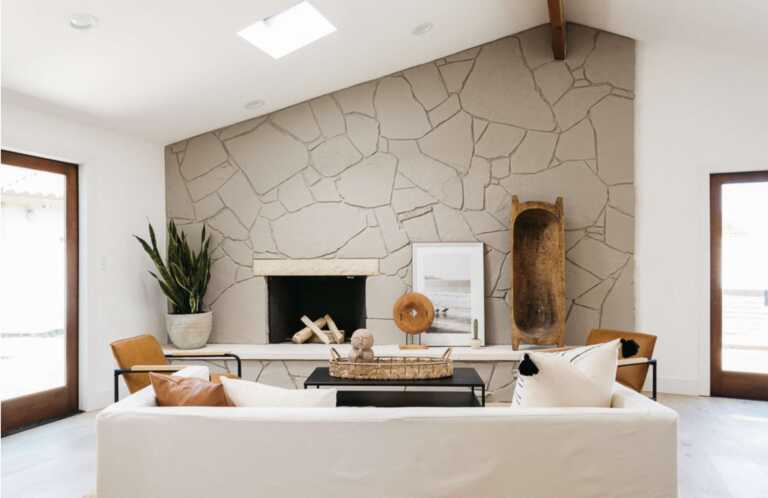 Beige stone fireplace radiating a minimalist and modern look for the living room
