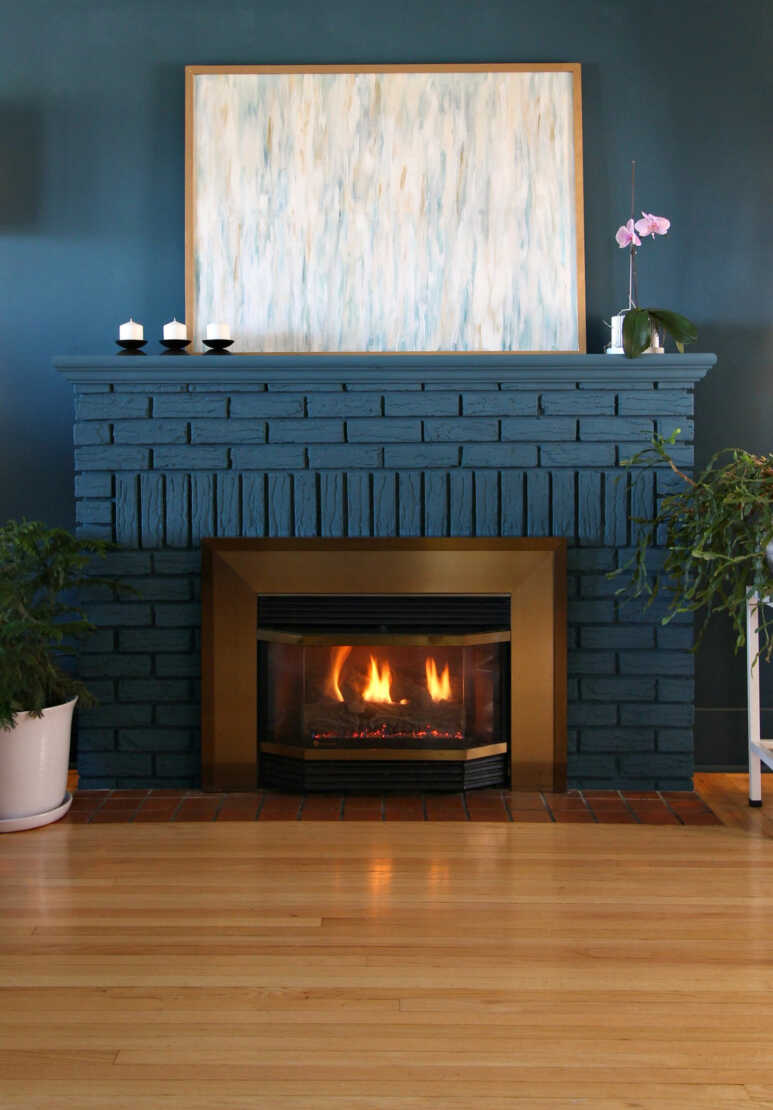 Building up a serene and peaceful ambiance with stone fireplace in coastal blue paint color
