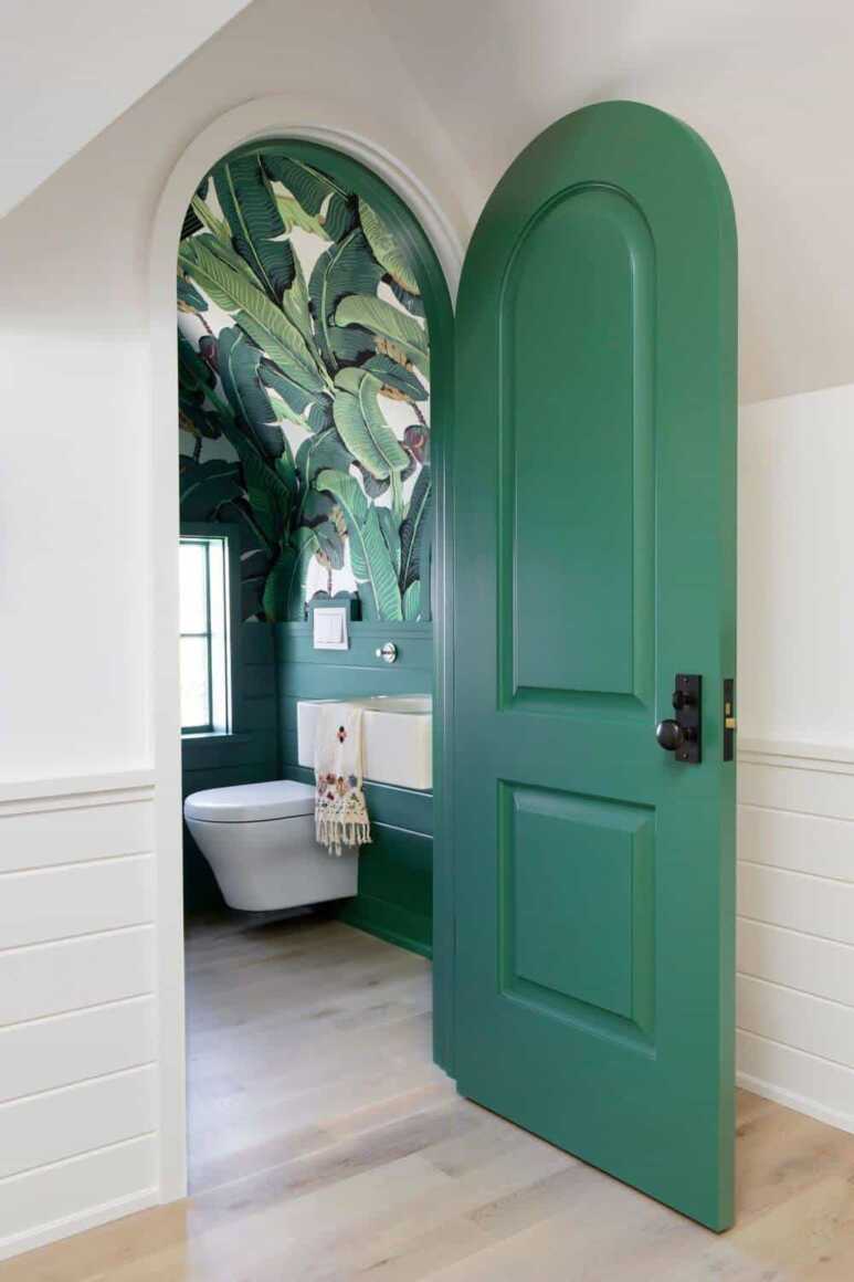 Green color with unique design for an appealing small bathroom door look