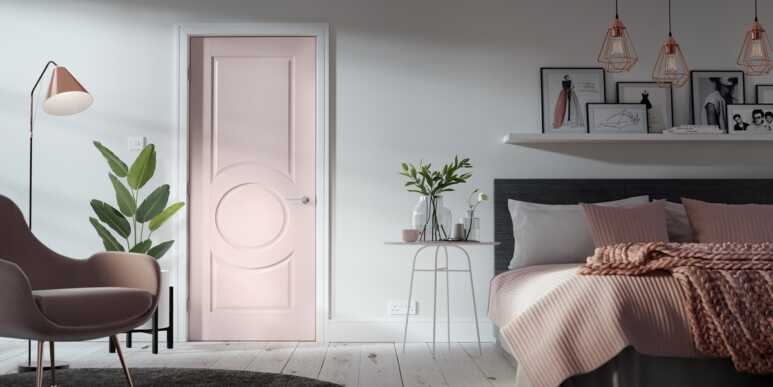 Staying simple yet still soft by placing a pink door on the white wall